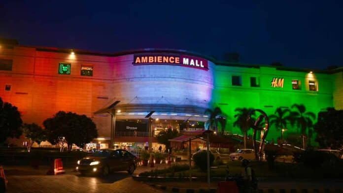 Ambience Mall decorated in Indian tricolour for 80th Independence Day celebrations, featuring the Eternal Flame of Valour installation.