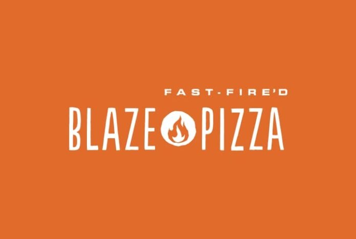 Freshly baked Blaze Pizza coming out of a high-temperature fire-deck oven