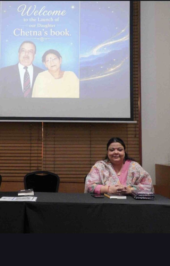 Author Chetna Shridhar with her spiritual book A Colloquy exploring inner wisdom and the Higher Self.